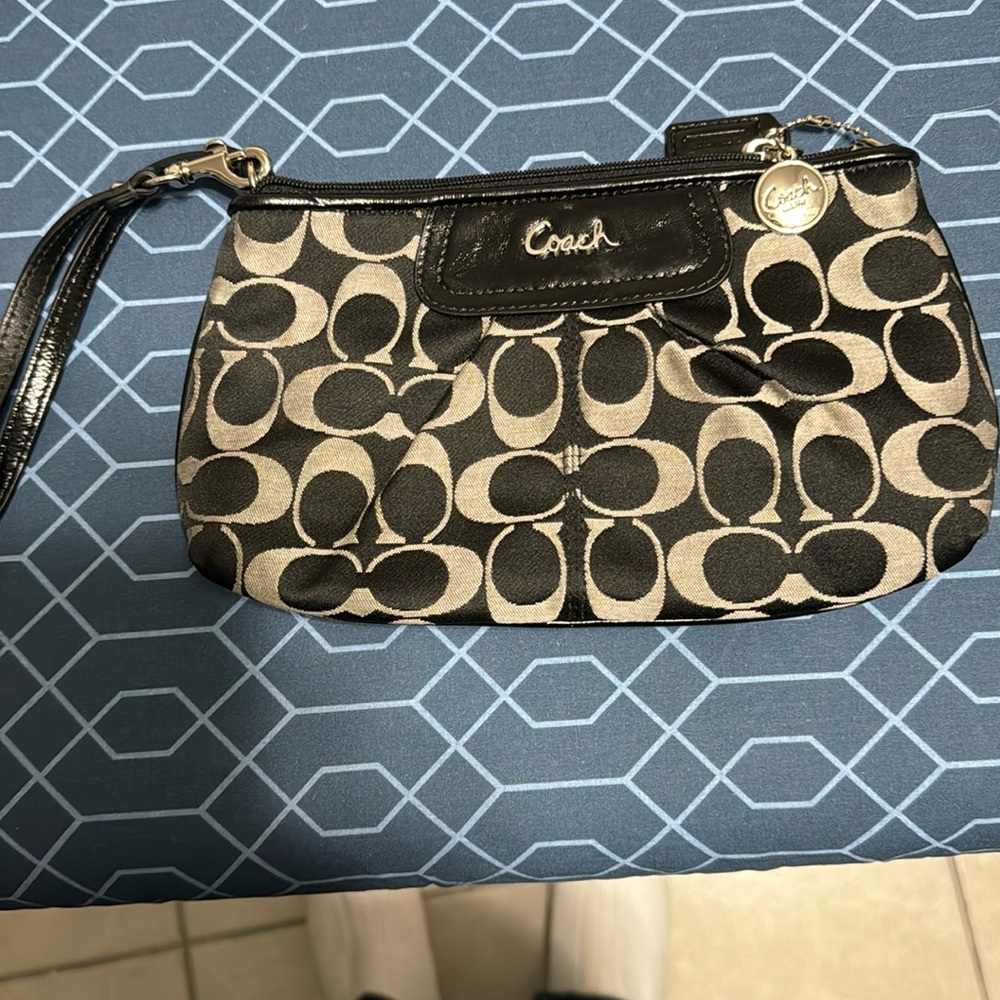 Coach black wristlet with black leather trim and black strap